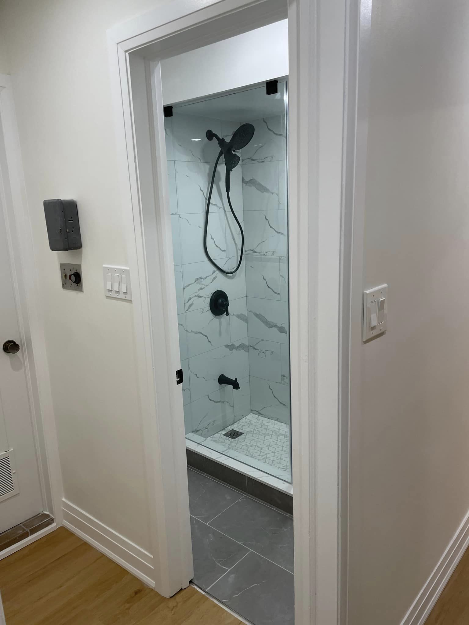 North York basement bathroom after renovation with marble tile shower