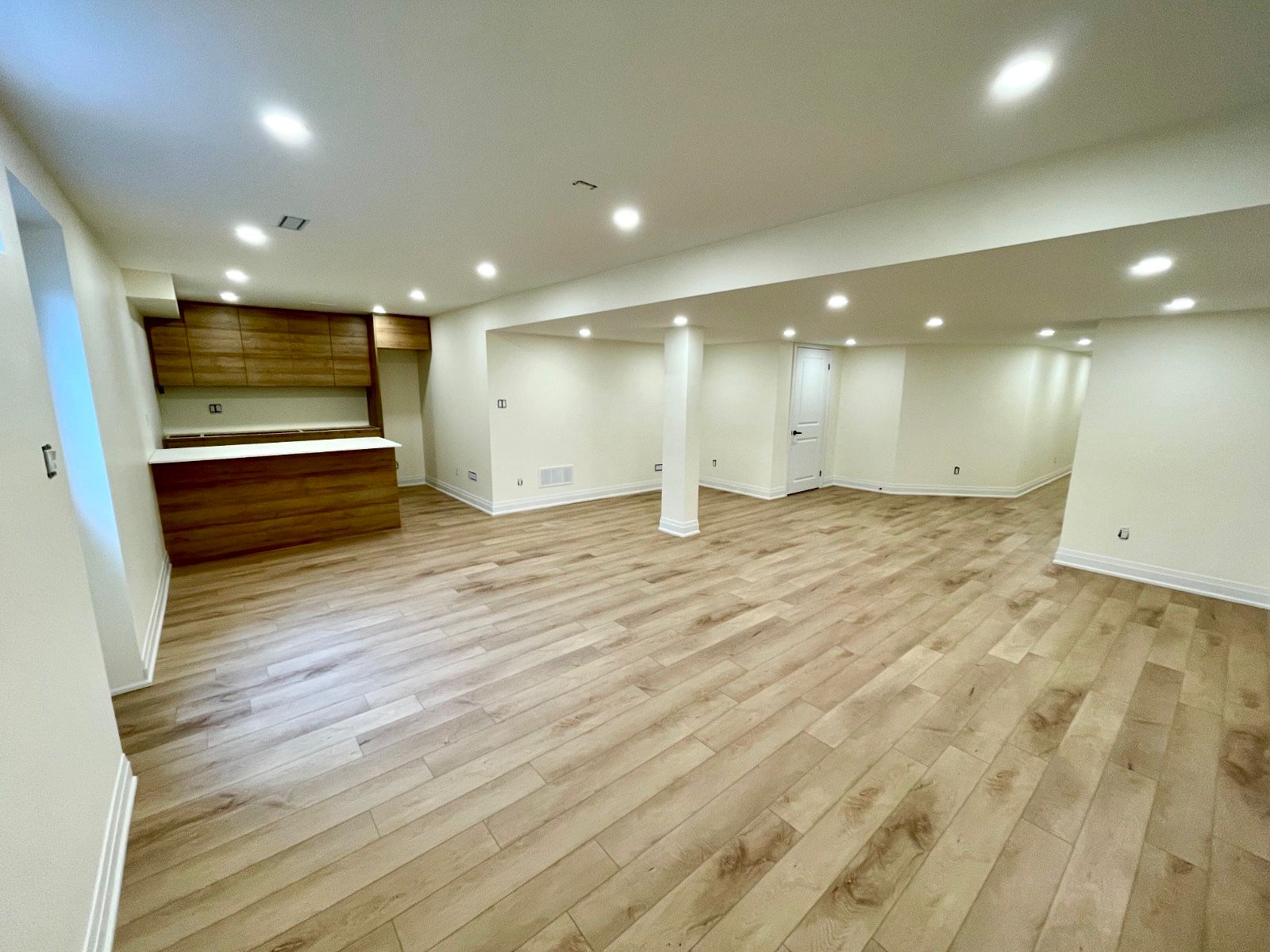 Richmond Hill basement living space with ceiling bulkheads